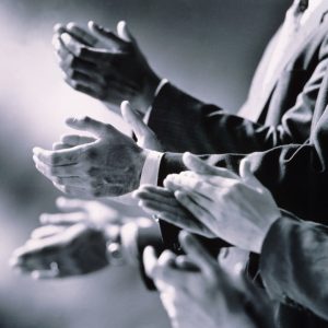 Black and white photo of hands clapping