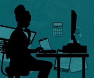 Silhouette of woman at computer screen