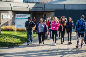 Student ambassador at BU leading a campus tour on Talbot Campus