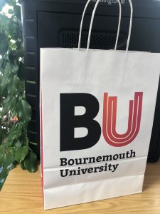 BU branded paper bag