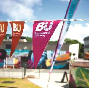 BU bunting at Talbot Campus on a sunny day