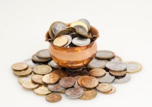 Pot with coins overflowing