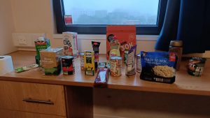 Food items on a desk as part of a isolation welcome pack given to students on arrival at BU