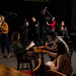 Students filming a show
