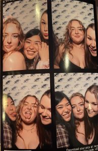 Eliza and her friends take photos on a night out in Bournemouth in a photobooth