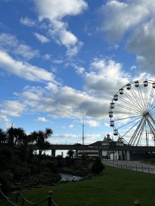 Blue skies with clouds and the bournemouth wheel in the distance