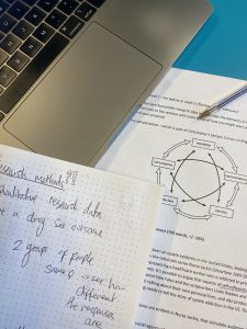 university notes and a laptop 