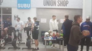 People taking part in a charity bike ride outside the SUBU shop