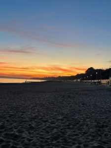 Blue and orange sunset at sandy Bournemouth Beach 
