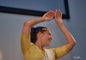A women dancing with her hands in the air 