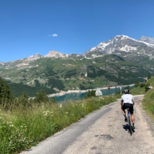 BU student Tom is riding his bike in the French Alps on a sunny day