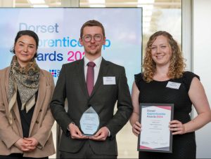 Four people smiling to camera. All have won awards at the Dorset Apprenticeship Awards 