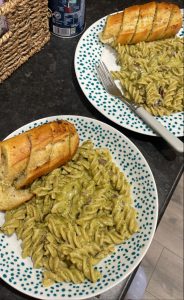 Photo of home made pesto pasta with garlic bread.