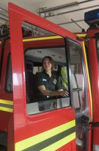 Woman in a fire service truck