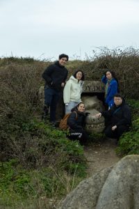 Osher and friends posing for a picture in a natural landscape